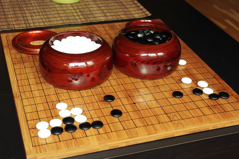 Bamboo go board with glass stones.